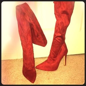 Red velvet thigh high boots.